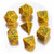 Photo of 7 polyhedral dice in yellowish orange with snakelike scales and numbers in green ink.