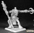 Pathfinder Dorella Kreeg Ogre Shaman. An unpainted mini of an ogre holding a staff, with an axe in their outreached arm. The axe has a skull embedded in the top.
