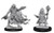 An image of both included versions of evil wizard. The left version is a tall, muscular figure in head to toe leather, a feathery, tattered cloak on their shoulders fluttering in the wind with a hood that comes up and completely covers the eyes. One hand is outstretched casting a spell while the other is held behind him holding an open tome cover up pages down. Both arms bear dangling chains. The right version is of a smaller stature (halfling or gnome) and has a beard and shaggy hair. He takes a wide stance and wears ornate robes and a small tiara, one hand holding open a book and the other holding up a staff topped with magic. (Front View)