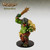 A large, pot-bellied, underbitten, green troll in scant, crude, fur armor. A metal helmet covers its eyes over its open, slavering maw. One hand holds a brutish wooden club high and ready to strike. (Front View)