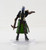 This lavender-skinned elf stands in a battle-ready pose, her hair white and eyes pupilless. Dressed in dark green and gold light armor, she holds one hand out in a commanding gesture while the other holds a loaded crossbow at her side. (Front View)