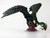 This dragon has an incredibly long neck and terrible claws. The beast shrieks and babbles, perched on a rock thrashing its tail and wings in a violent manner. (Side View)