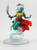This creature stands nearly twice as tall as a human, although her lower torso trails away into a vortex of mist and wind. She wears a saffron top and bright scarlet jacket that complement her seafoam green skin and light blue tattoos. Her white hair is done up but waving wildly in her self made breeze, and both arms are out in a friendly, welcoming gesture despite her right hand holding a large scimitar. (Front View)