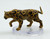 This large, powerful big cat is a warm golden color covered in black rosettes. It appears to be on the prowl. (Side View)