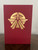 Detailed image of the book's gold foil cover depicting the logo of the Starfinder Society.