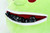 Pathfinder Dice Gobblin' Goblin Plush Bag close up of the open zipper mouth, from which numerous dice can be seen.