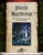 Faerie Mysteries PDF shows a wary explorer approaching a mysterious glowing portal deep in a patch of dark woodlands.