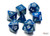 Chessex Speckled Poly Set Stealth 7, a set of polyhedral dice featuring blue and black speckled design with white numbers on a white background, including d20, d18, d12, d10, d8, d6, and d4.