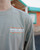 Close-up of the chest of the long-sleeve shirt, clearly showing the small coral and white 'Bahama Buck's' logo.