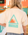 Back view of a young woman with blonde hair wearing the off-white "Avalanche Crew" t-shirt, highlighting the large teal triangular warning sign graphic and "CAUTION AVALANCHE CREW" text.