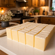 Pure grass-fed tallow soap bars displayed in a rustic kitchen setting