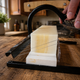 Small-batch pure tallow soap being handcrafted and cut into individual soap bars