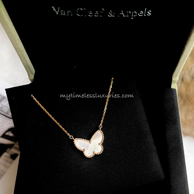 VAN CLEEF & ARPELS, YELLOW GOLD AND ONYX 'SWEET ALHAMBRA BUTTERFLY'  NECKLACE