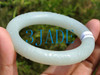 white jade bangle with carved pattern