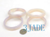 Lot 3 agate bangles under lighting.