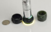 Nephrite jade thumb rings showing translucency under strong flashlight