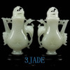 Back view of the two vases displayed together under lighting.