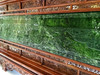 Side angle of the jade screen highlighting the detailed woodwork and jade craftsmanship.
