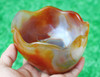 Handheld view of carnelian agate bowl in natural light