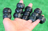 Assorted carved nephrite jade thumb rings shown from another angle