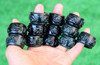 Group of carved nephrite jade thumb rings photographed in natural light