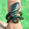 Another carved jade cobra thumb ring in natural light