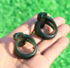 Interior view of carved nephrite jade cobra thumb rings