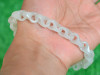 carved jade chain bracelet worn on wrist natural light C004518A