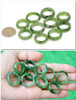 Assorted sizes 17mm to 20mm green jade rings set SKU F012055F displayed in hand