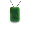 G026541A Single Variant A green Canadian jade rectangular pendant with natural black chromium spots on cord.