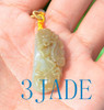 Hand-carved jade beetles