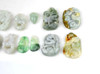 Close-up of jadeite pendants in dragon and animal motifs, showing unique details