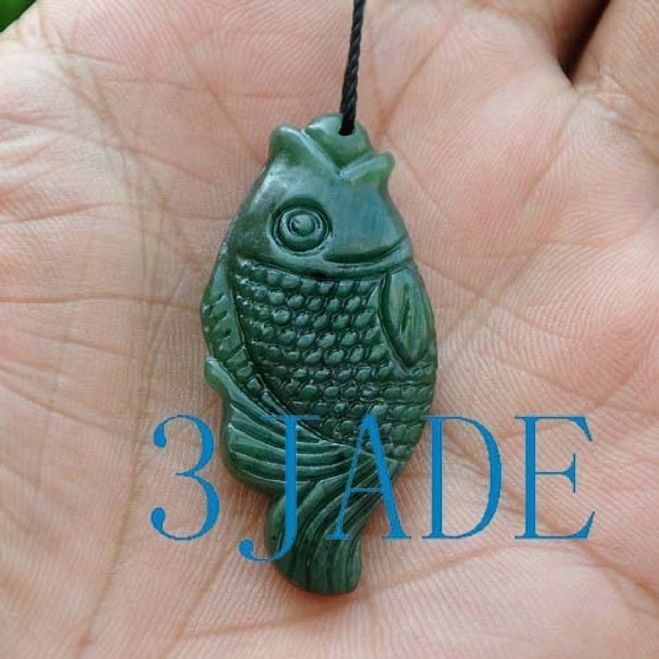 hand carved green nephrite jade fish pendant