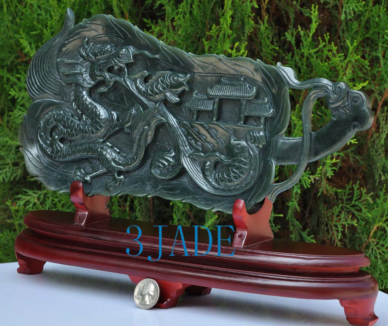 jade carp leaping over dragon gate sculpture