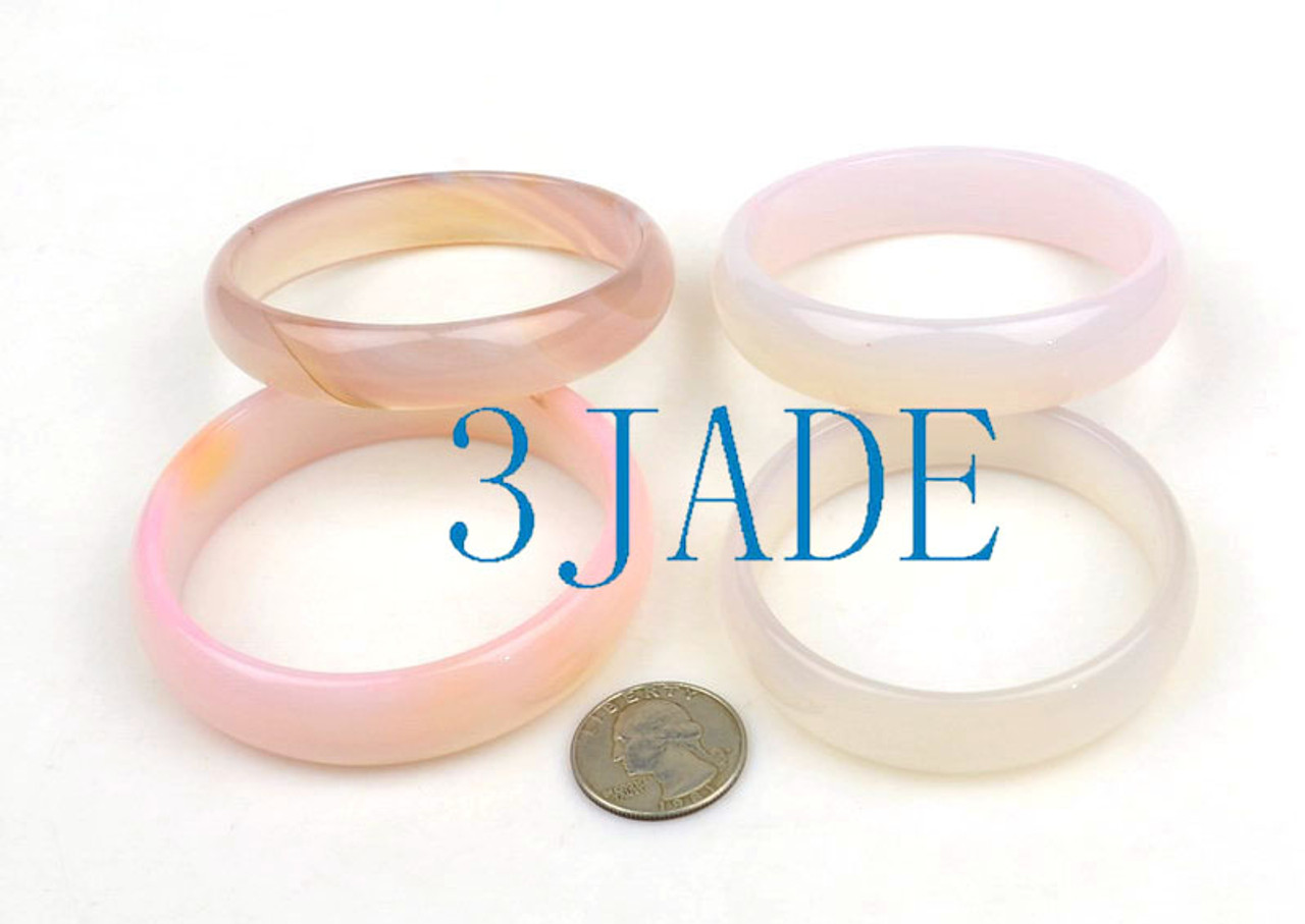 Lot 2 agate bangles under lighting.