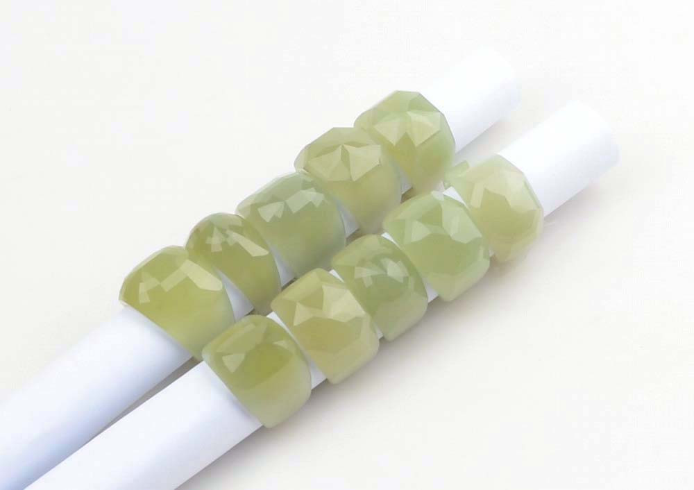 Side view of the nephrite jade rings showcasing the facets and shine.