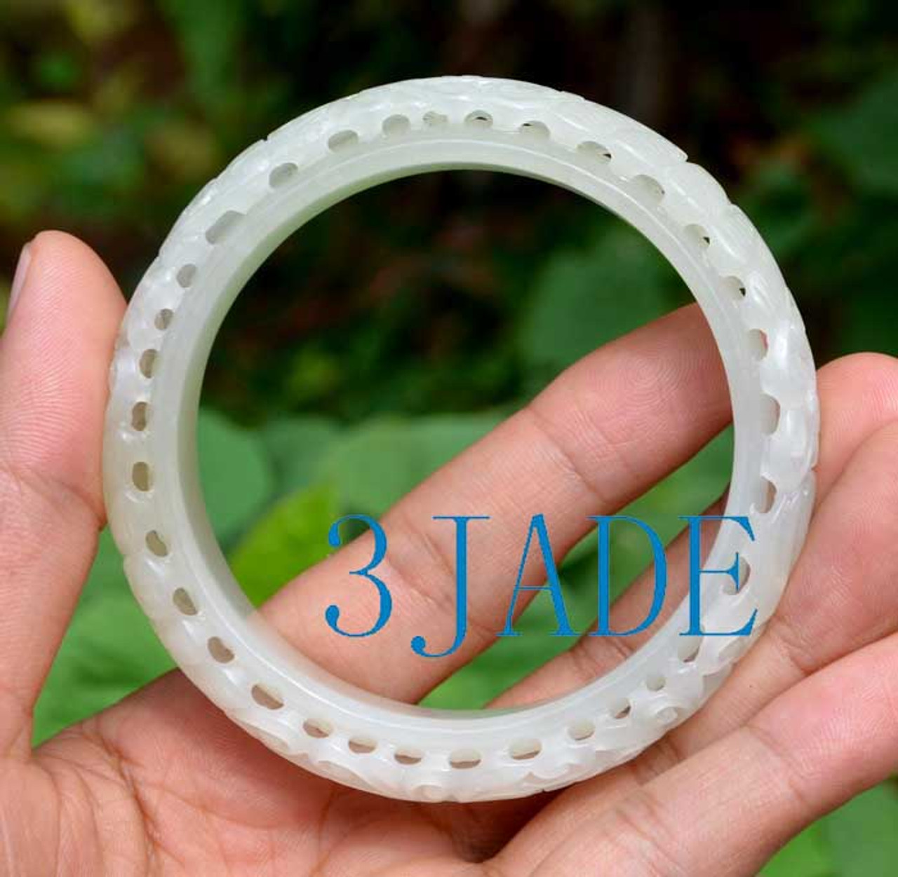 carved white jade bangle