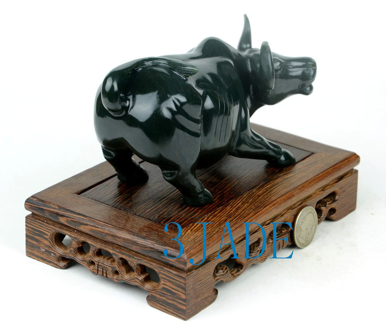 Hand-carved jade charging bull statue