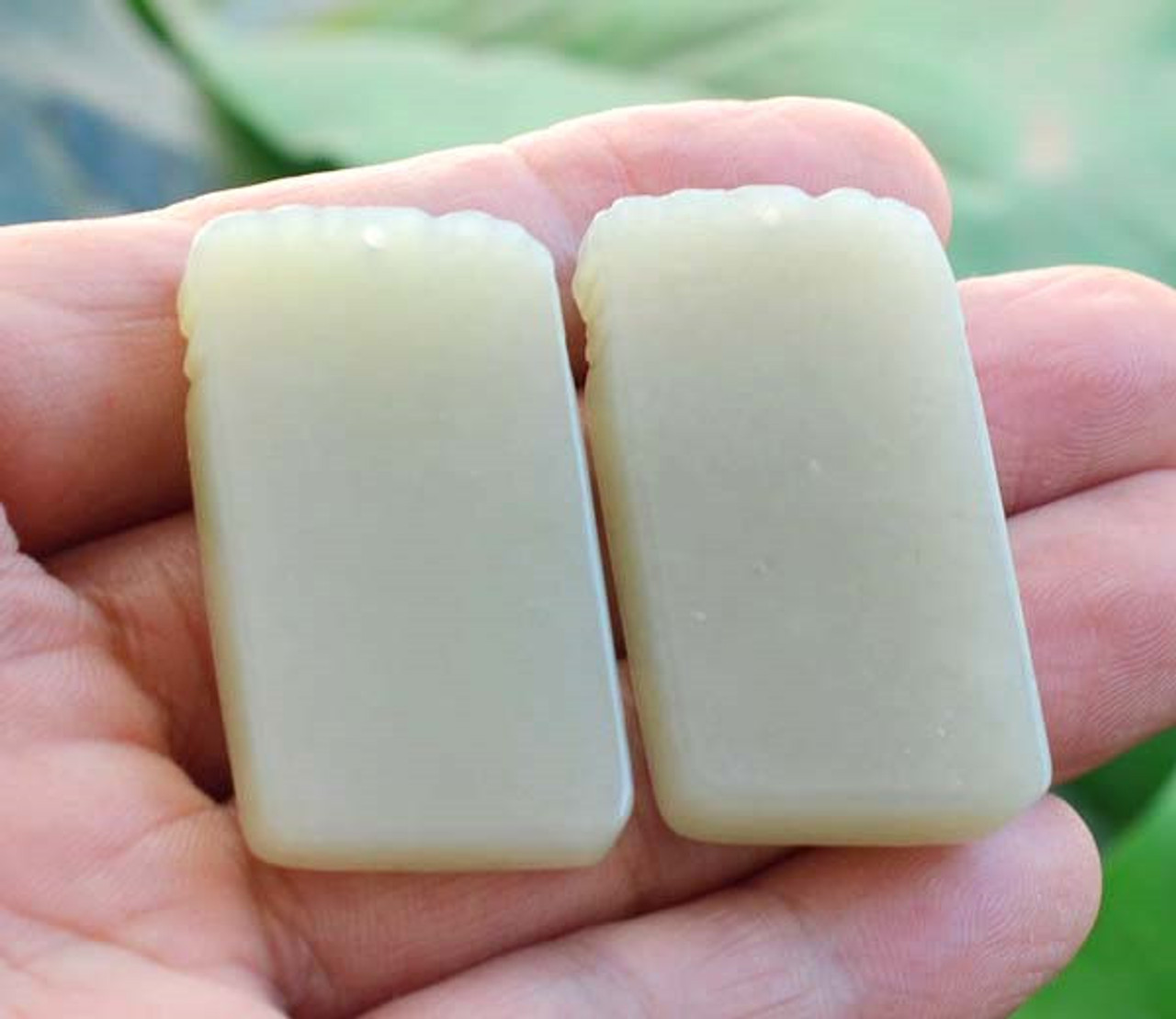 Back view of the nephrite jade bamboo pendant highlighting its polished finish.