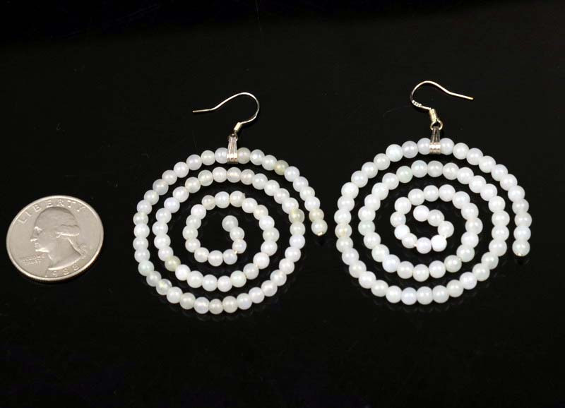 Koru-inspired spiral earrings made of jadeite beads