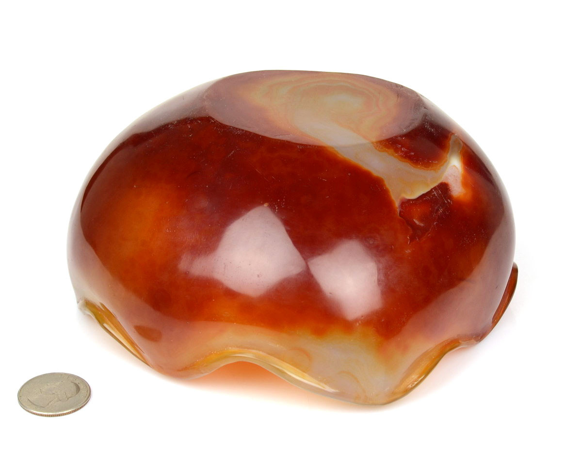 Bottom view of carnelian agate bowl under studio lighting