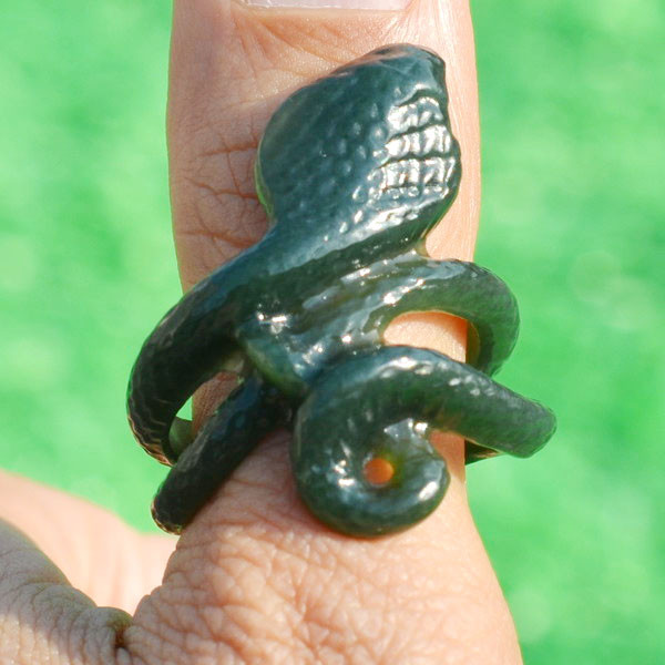 Another carved jade cobra thumb ring in natural light