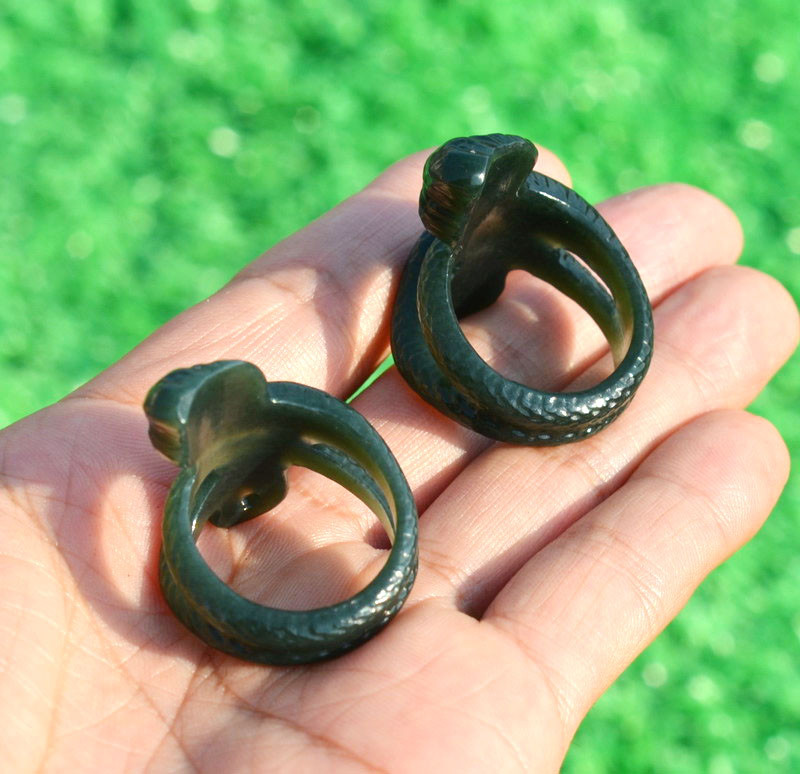 Interior view of carved nephrite jade cobra thumb rings