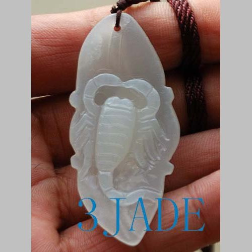 white nephrite jade scorpion under natural light