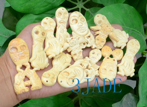 hand carved skull / skeleton figurine