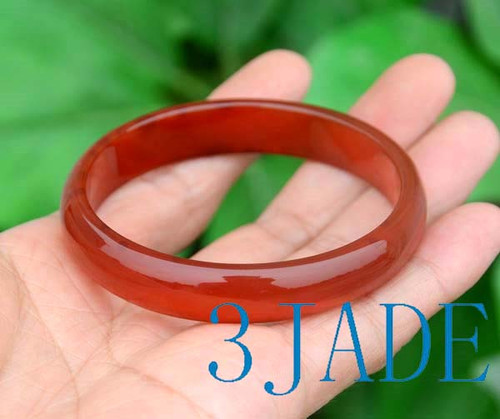 Five red agate bangles in D-shape design, grouped