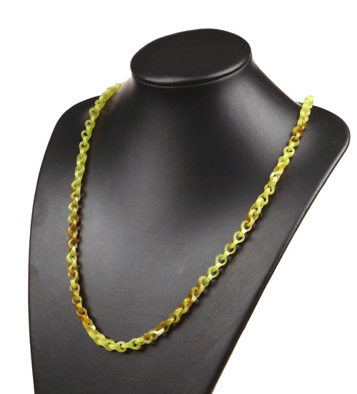 Handcrafted natural nephrite jade chain link necklace displayed on a black bust.