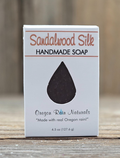 Boxed Sandalwood Silk Handmade 4.5 oz Soap bar with a raindrop cutout to smell and view this wonderful scent. "Made with real Oregon rain!"