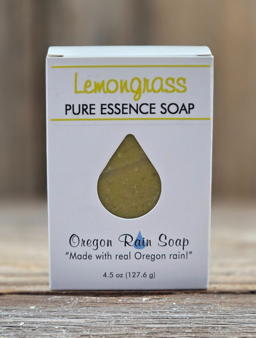 Boxed Lemongrass Pure Essence Handmade 4.5 oz Soap with an open raindrop that you can smell the awakening scent of lemongrass and see the beauty color herbal yellow of the soap.