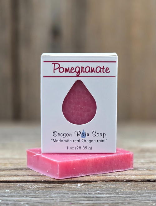 White boxed Pomegranate Handmade Soap 1 oz Guest & Travel bar with a cutout raindrop to view and smell the pretty colored soap.